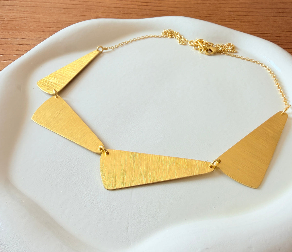 Geometric fan collar necklace in brushed brass